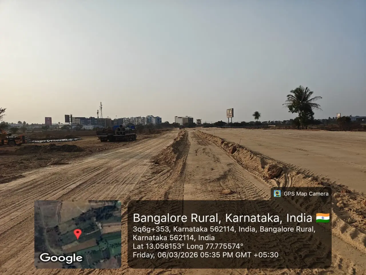 Featured Image of Sobha One Residences Site Progress March 2026 - Wide leveled site with precast pipe delivery truck, GPS-stamped Amanidoddakere Village