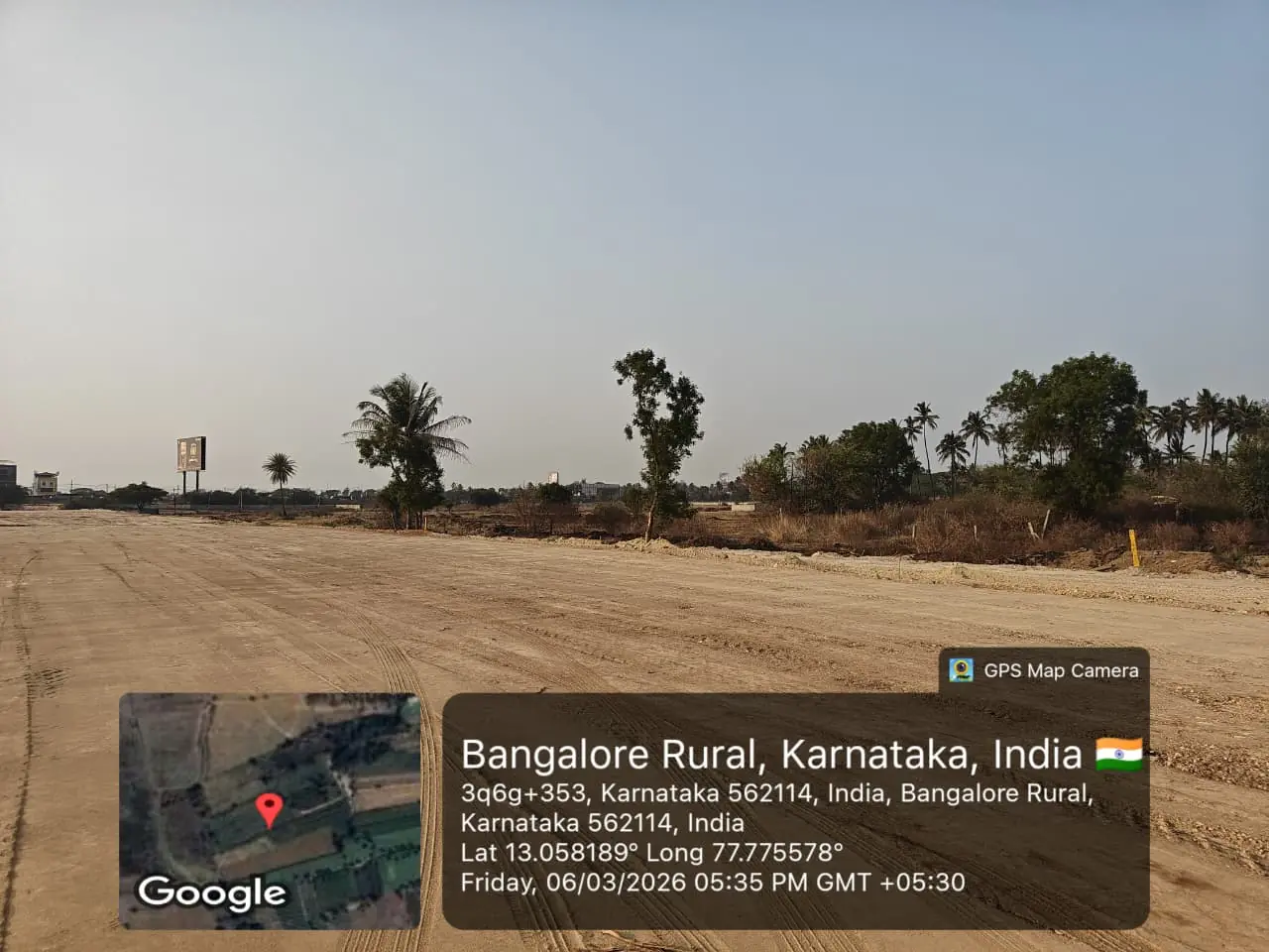Featured Image of Sobha One Residences Site Progress March 2026 - Cleared/leveled site with billboard and palm tree line, GPS-stamped Amanidoddakere Village