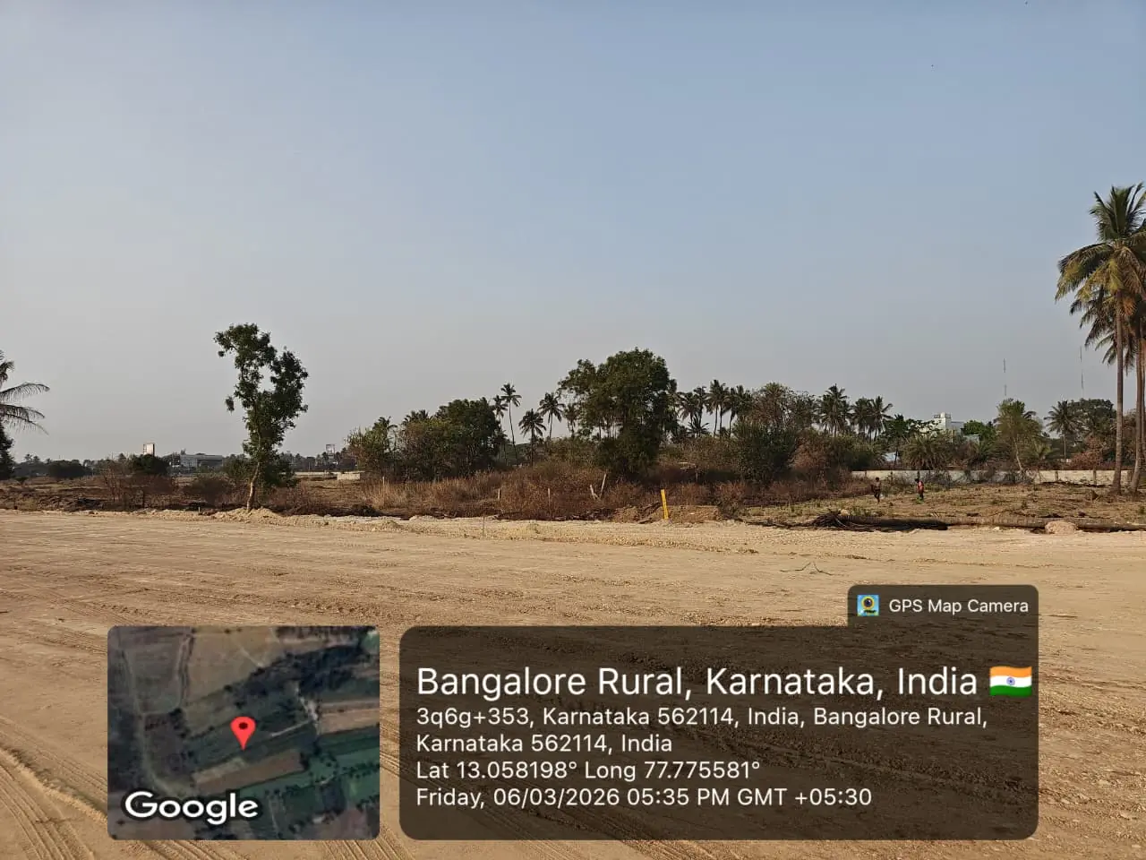 Featured Image of Sobha One Residences Site Progress March 2026 - Leveled site with adjacent tree line boundary, GPS-stamped Amanidoddakere Village